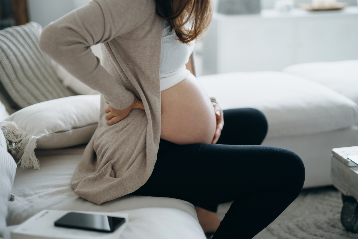 Pregnant woman dealing with back pain