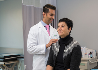 Dr. Kern Singh examining patient