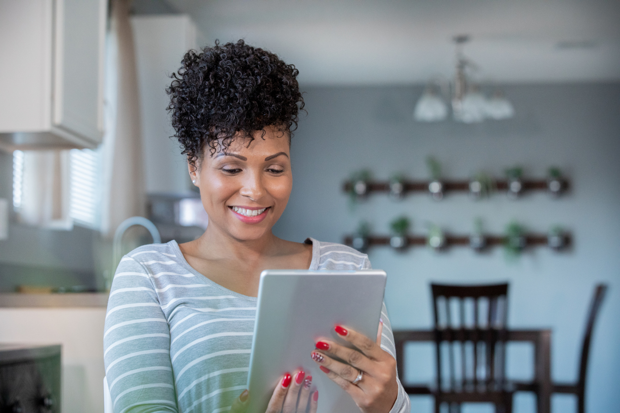 women using tablet for telemedcine visit with physician