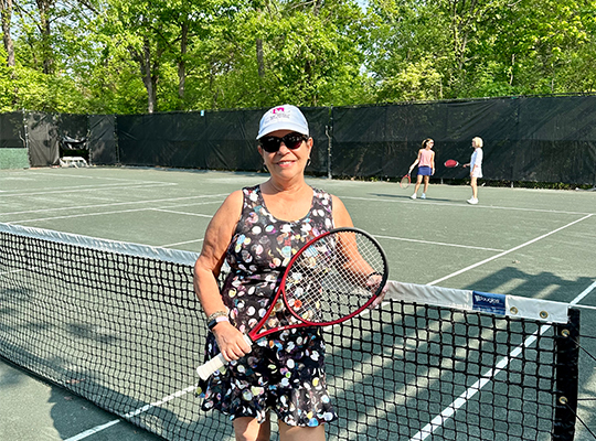 Patient Gina Quatrochi on tennis court