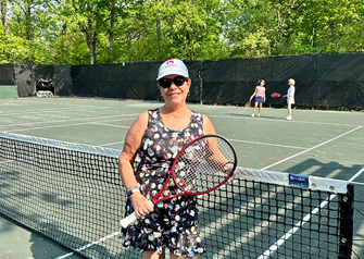 Patient Gina Quatrochi on tennis court