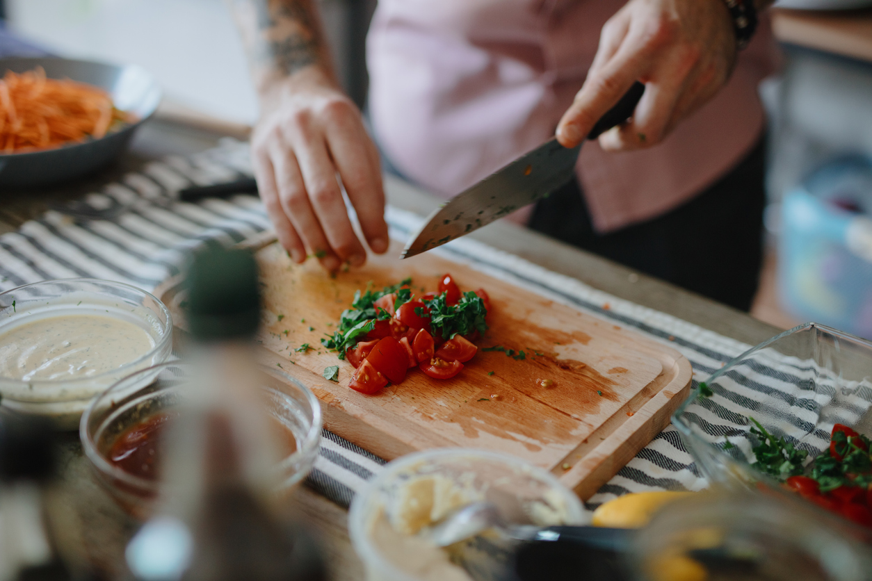 Person preparing food with kitchen knife