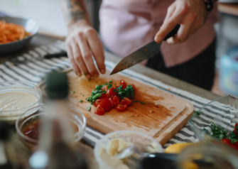 Person preparing food with kitchen knife