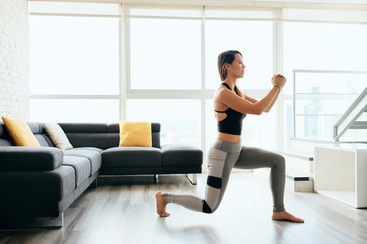 adult woman training legs doing lunges