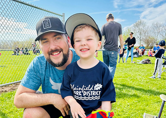 Patient Matt Adamski with his son