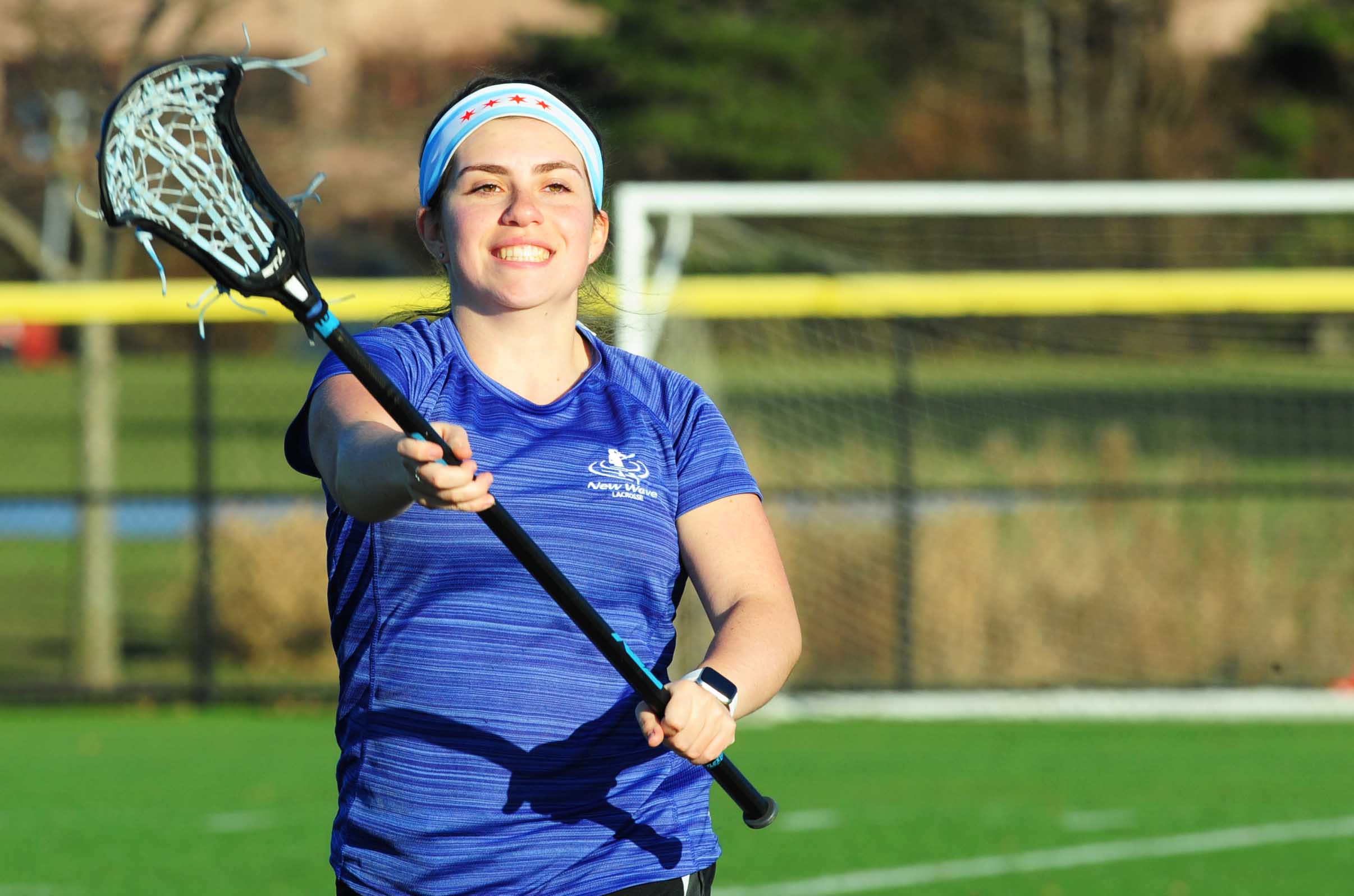 Patient Kalie Miller playing lacrosse