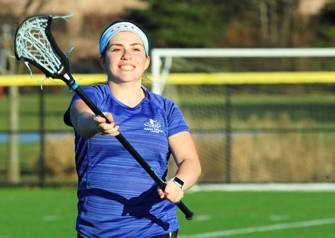 Patient Kalie Miller playing lacrosse