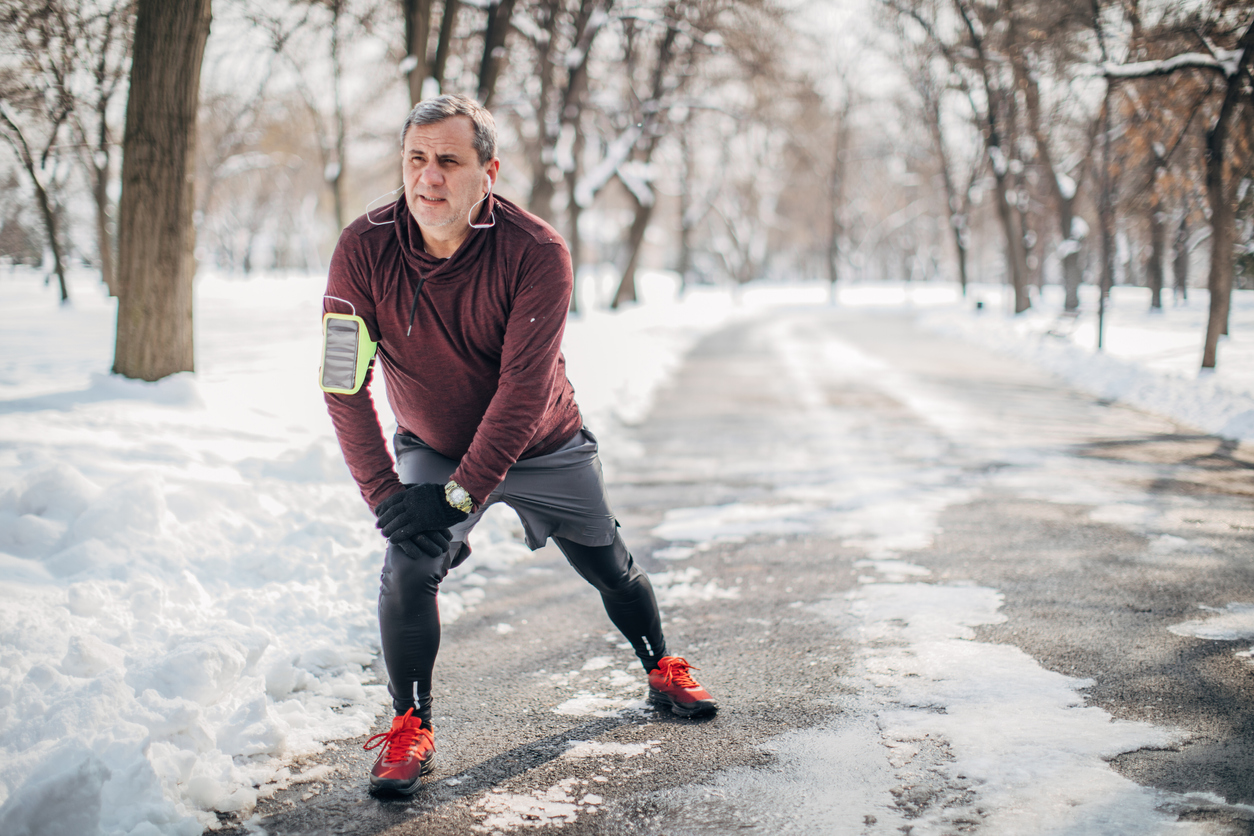 man stretching before jogging