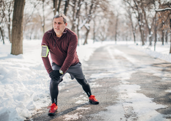 man stretching before jogging