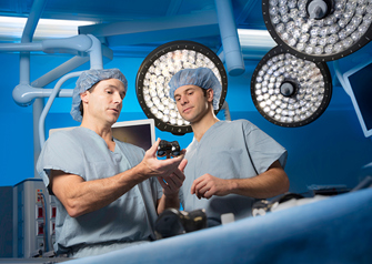 dr vasili karas and dr tad gerlinger in operating room